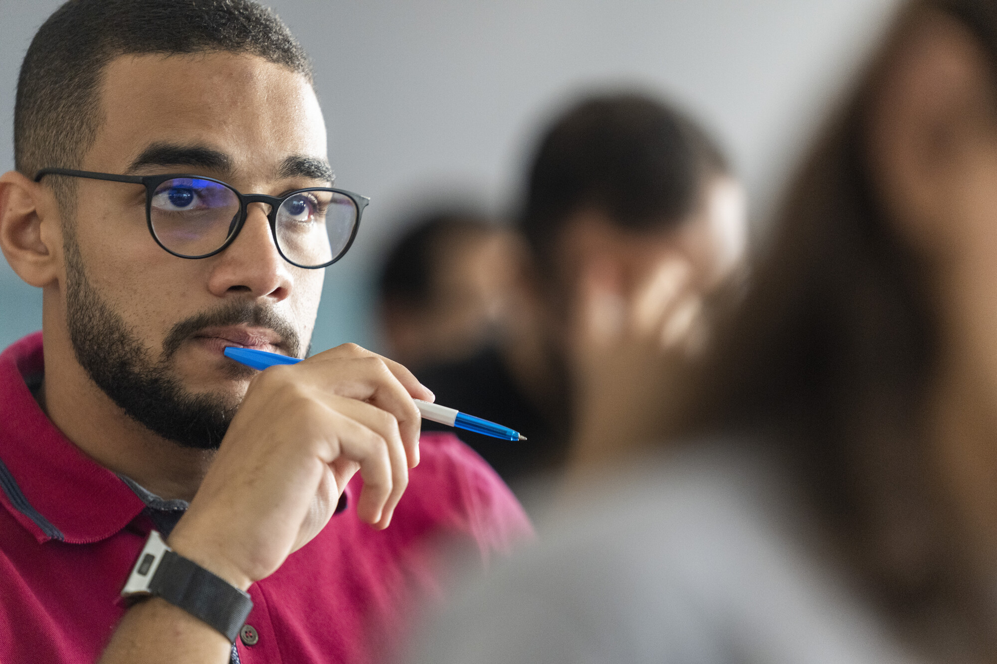 Male student focusing in class