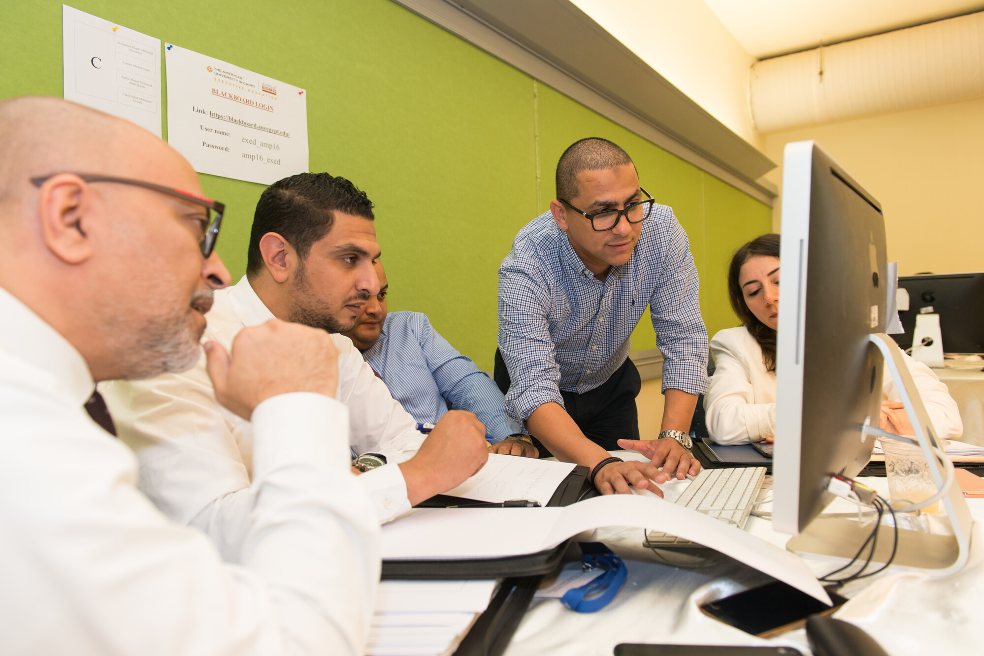 graduate students working on project in class