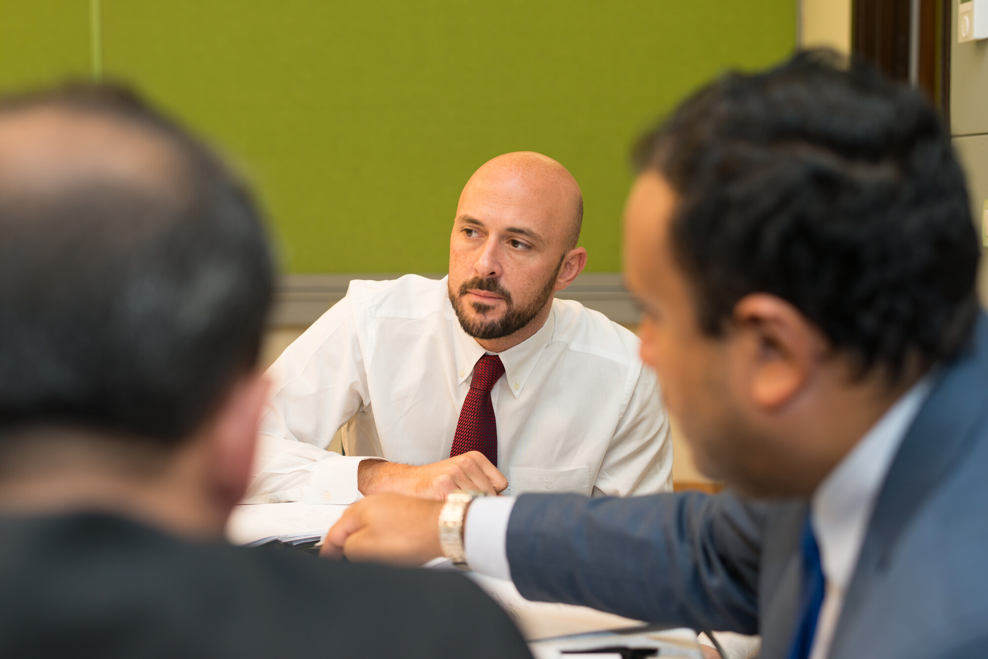 graduate students working in classroom on a project