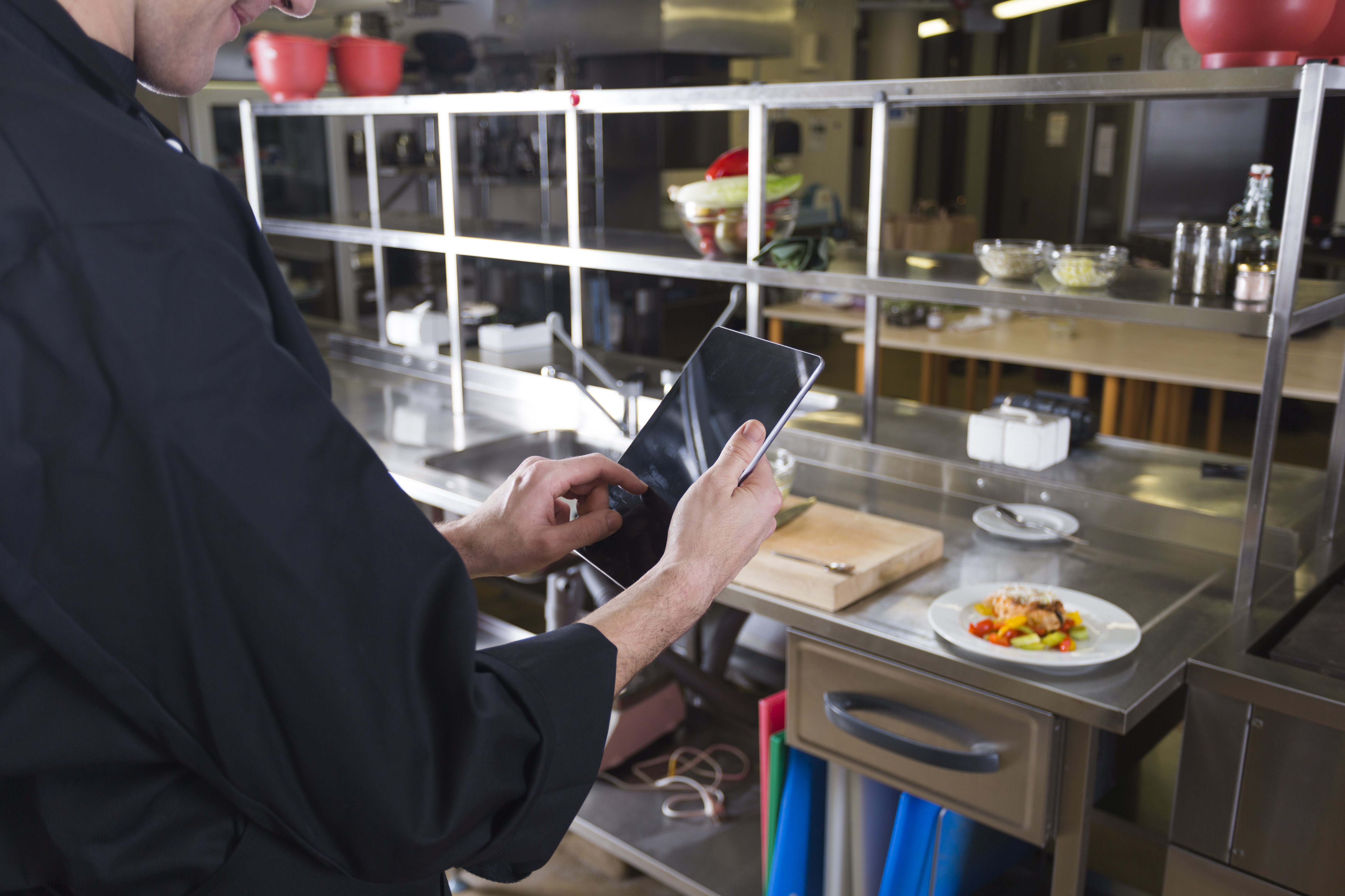 chef with an I-pad in the kitchen