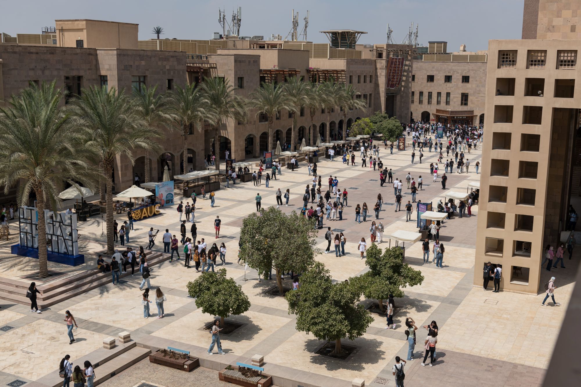 bartlett plaza during assembly hour with students walking on campus