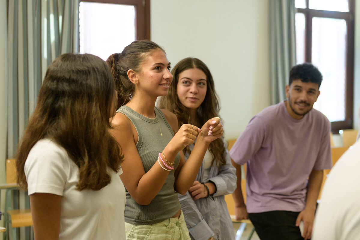 group of students in classroom discussing topic