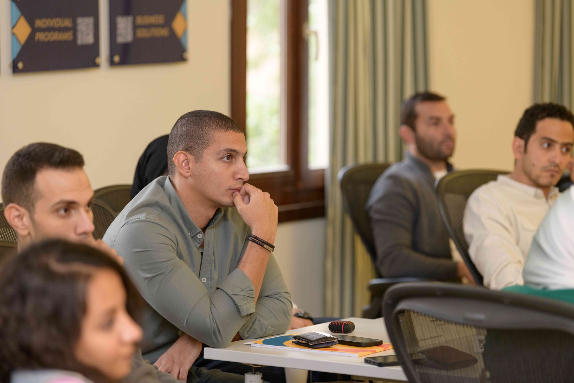 student in classroom listening to the faculty 