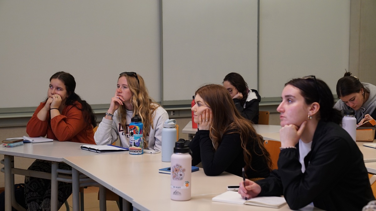 Female students sitting in class