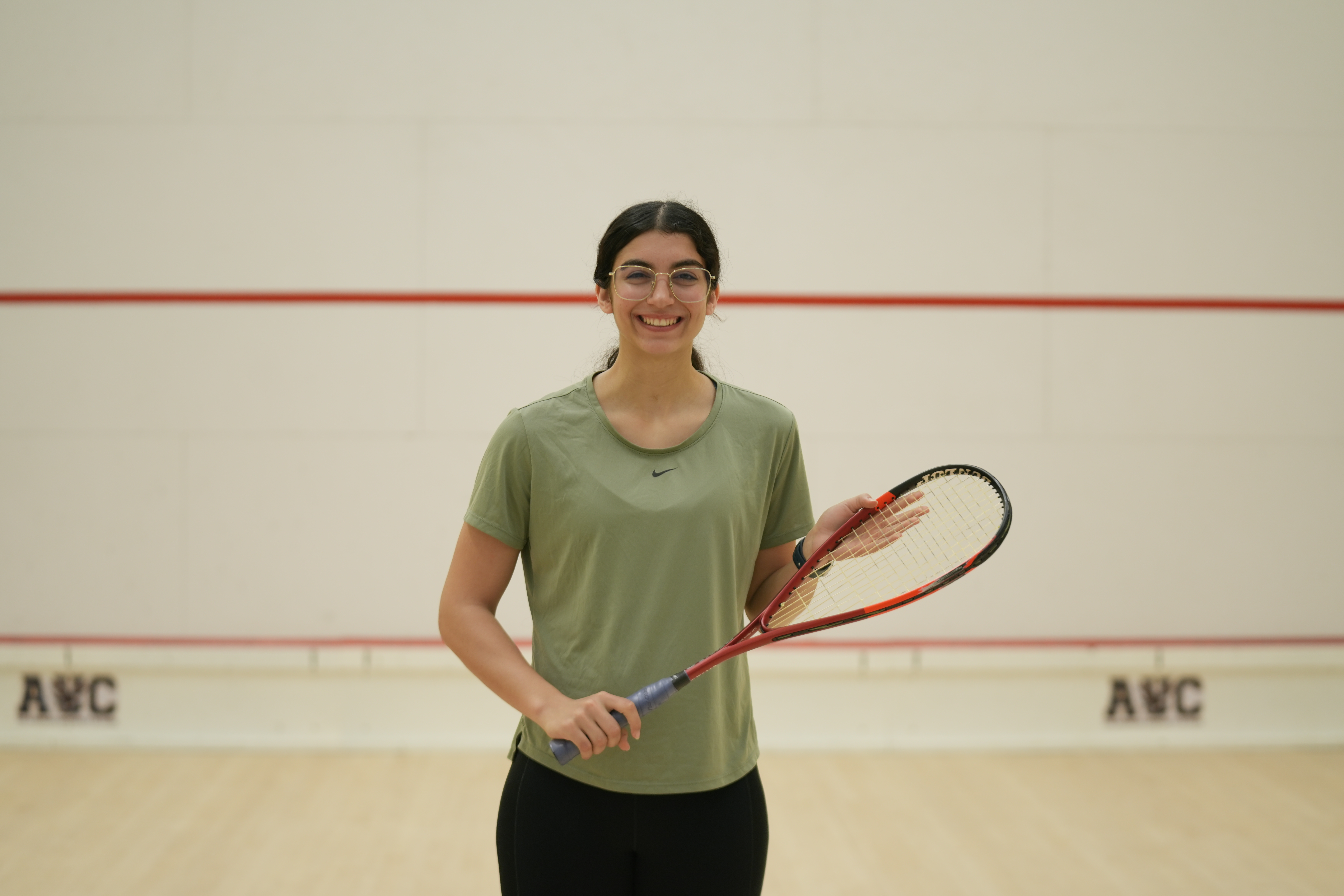 Amina Orfi plays squash