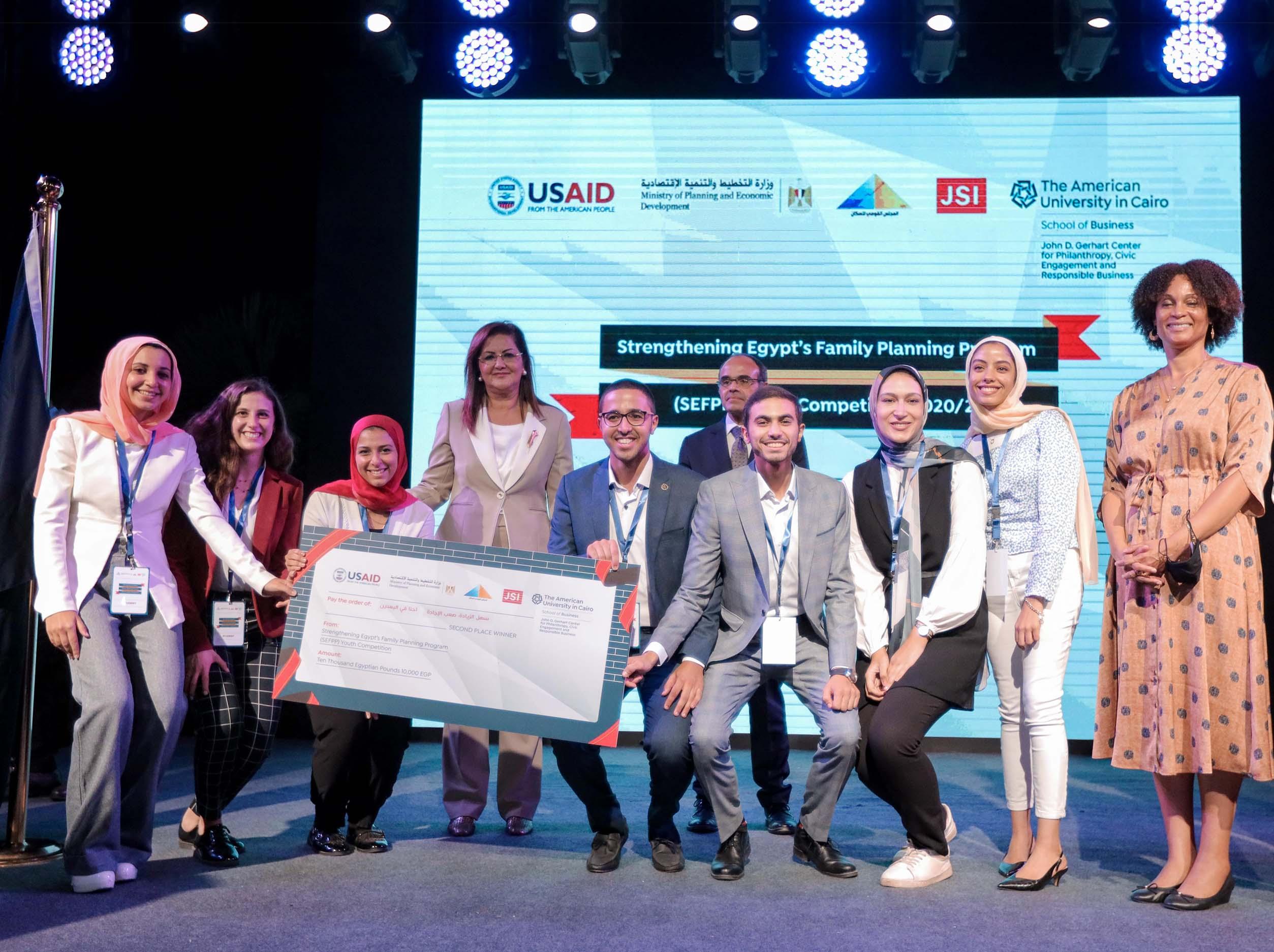 gerhart center student winners on stage holding winner cheque
