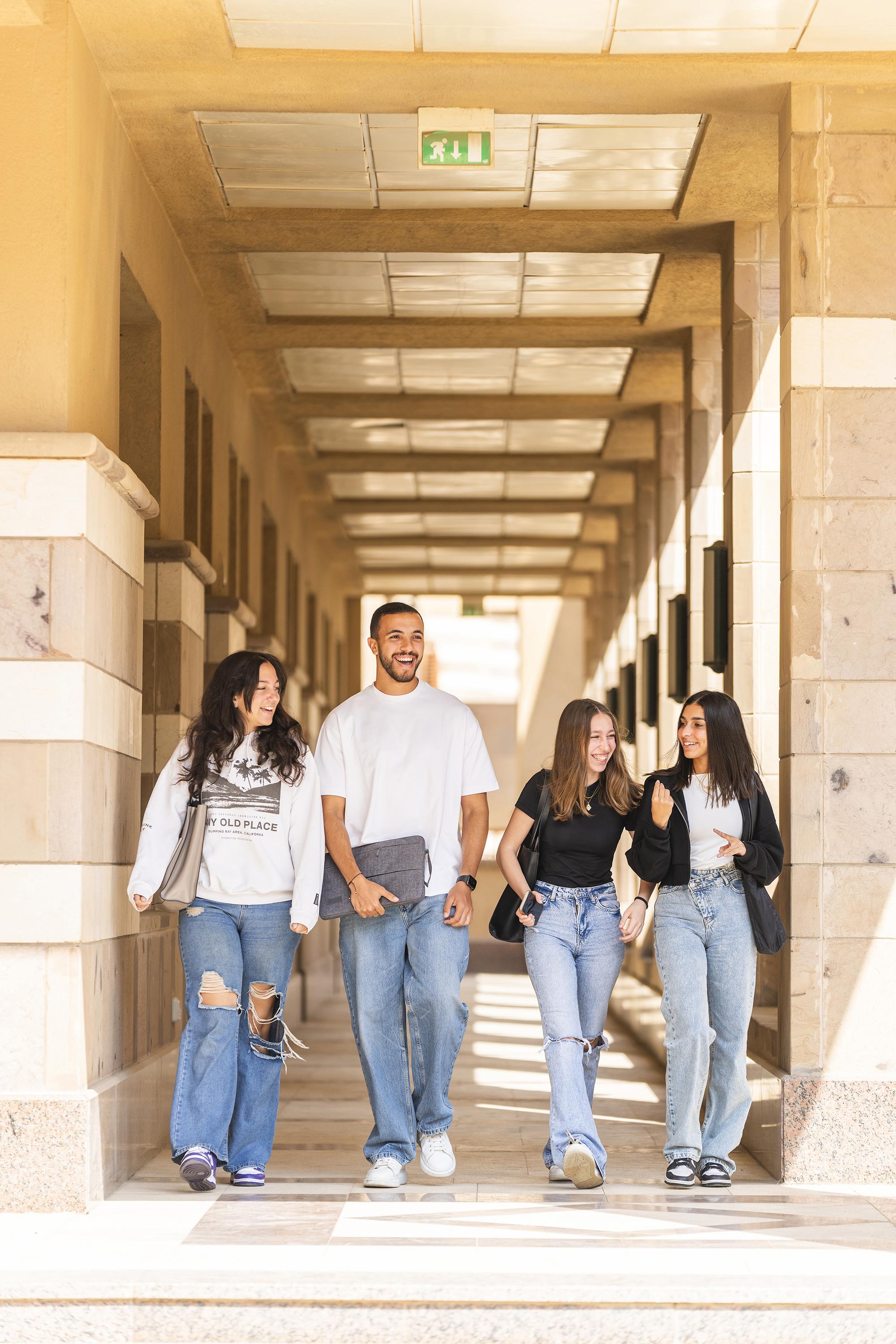 group of students talking and walking to class