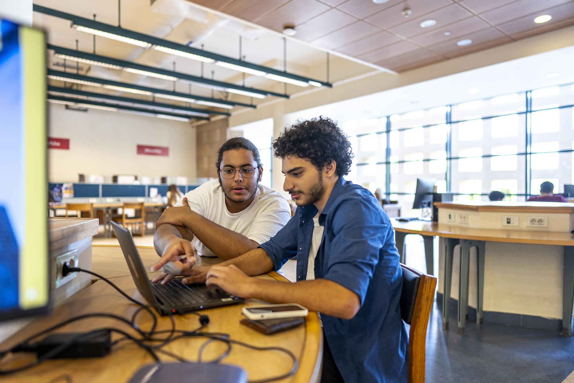students working on project on a laptop