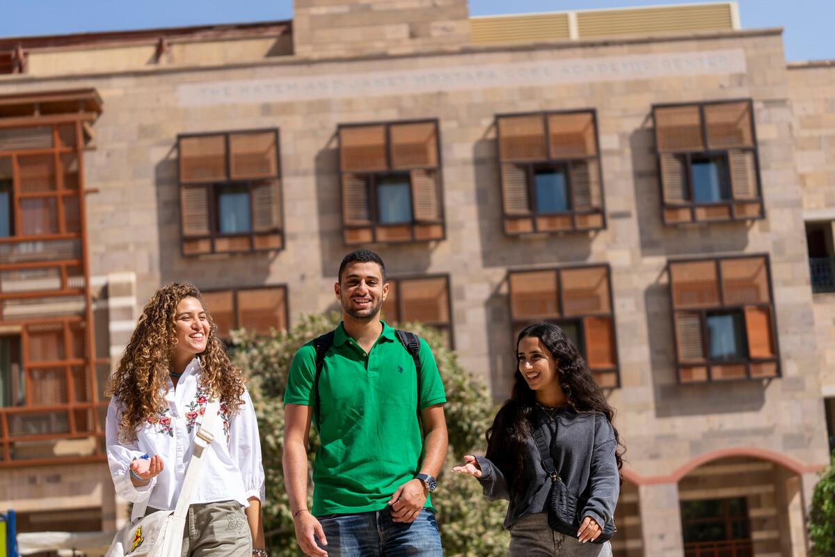 students walking in the plaza going to class
