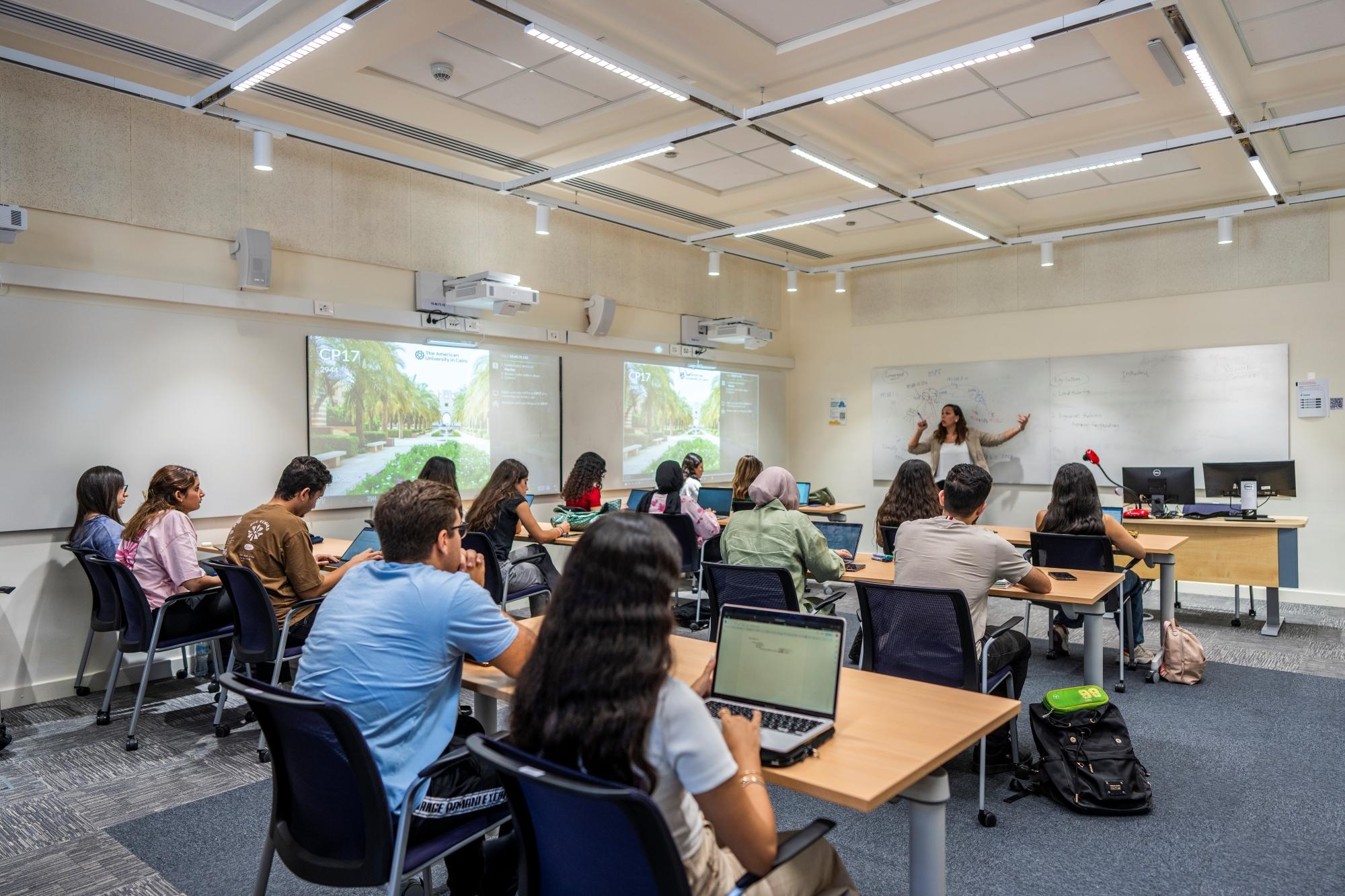 students attending class and professor explaining