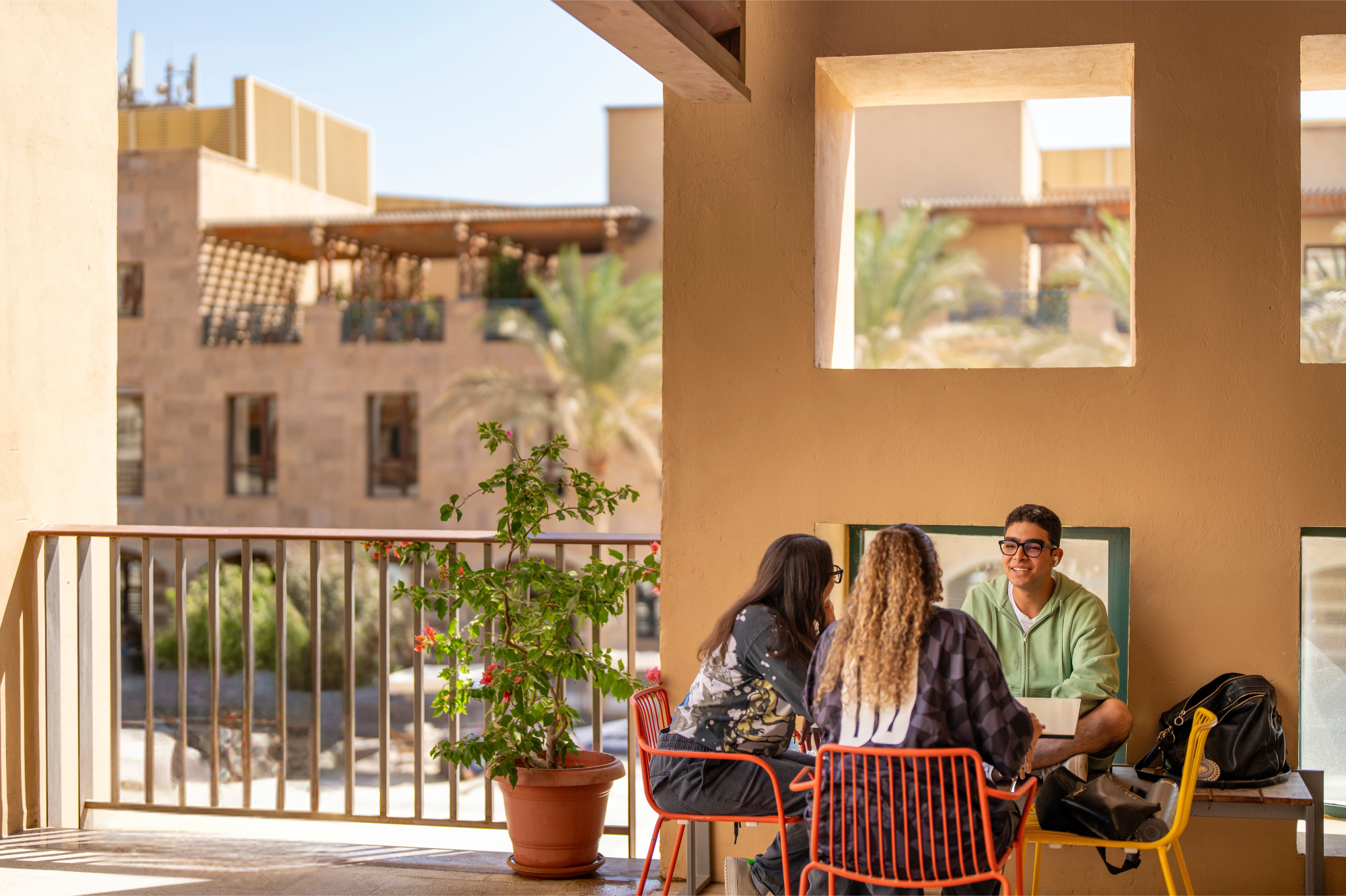 students in group discussion with professor in classroom