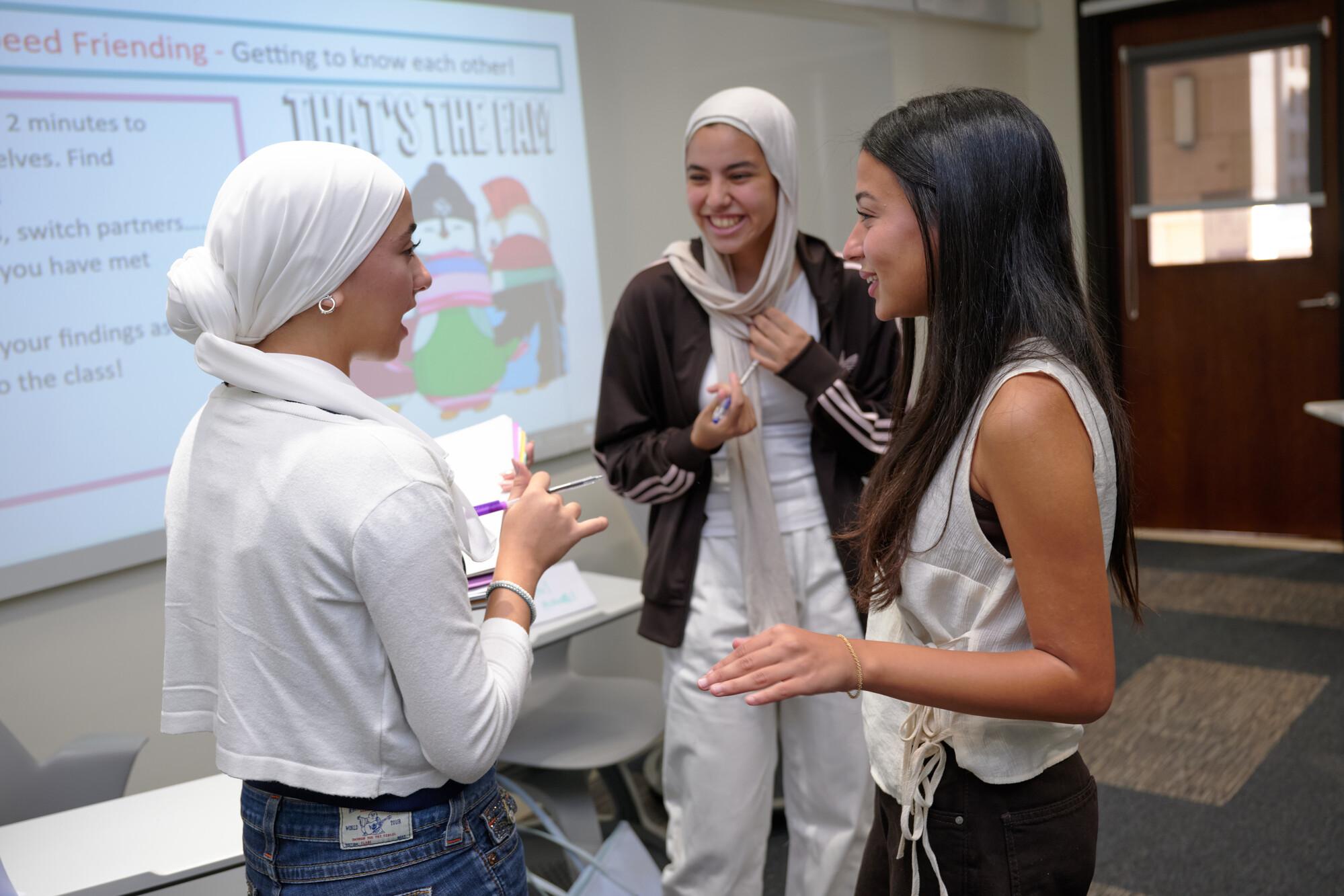 students in class room in a class discussion