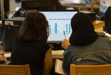 students studying in front of a computer