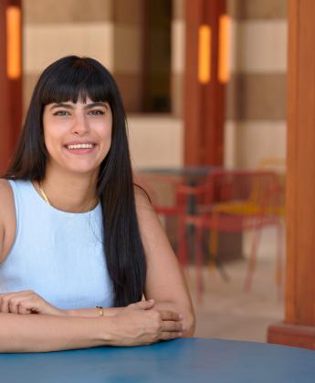 Yara Zidan sitting at a table