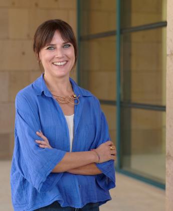 Marcella stands in front of the AUC library