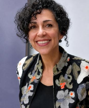 Nidaa wearing a floral pattern suit jacket