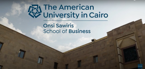 The top of a building. Text: The American University in Cairo. Onsi Sawiris School of Business