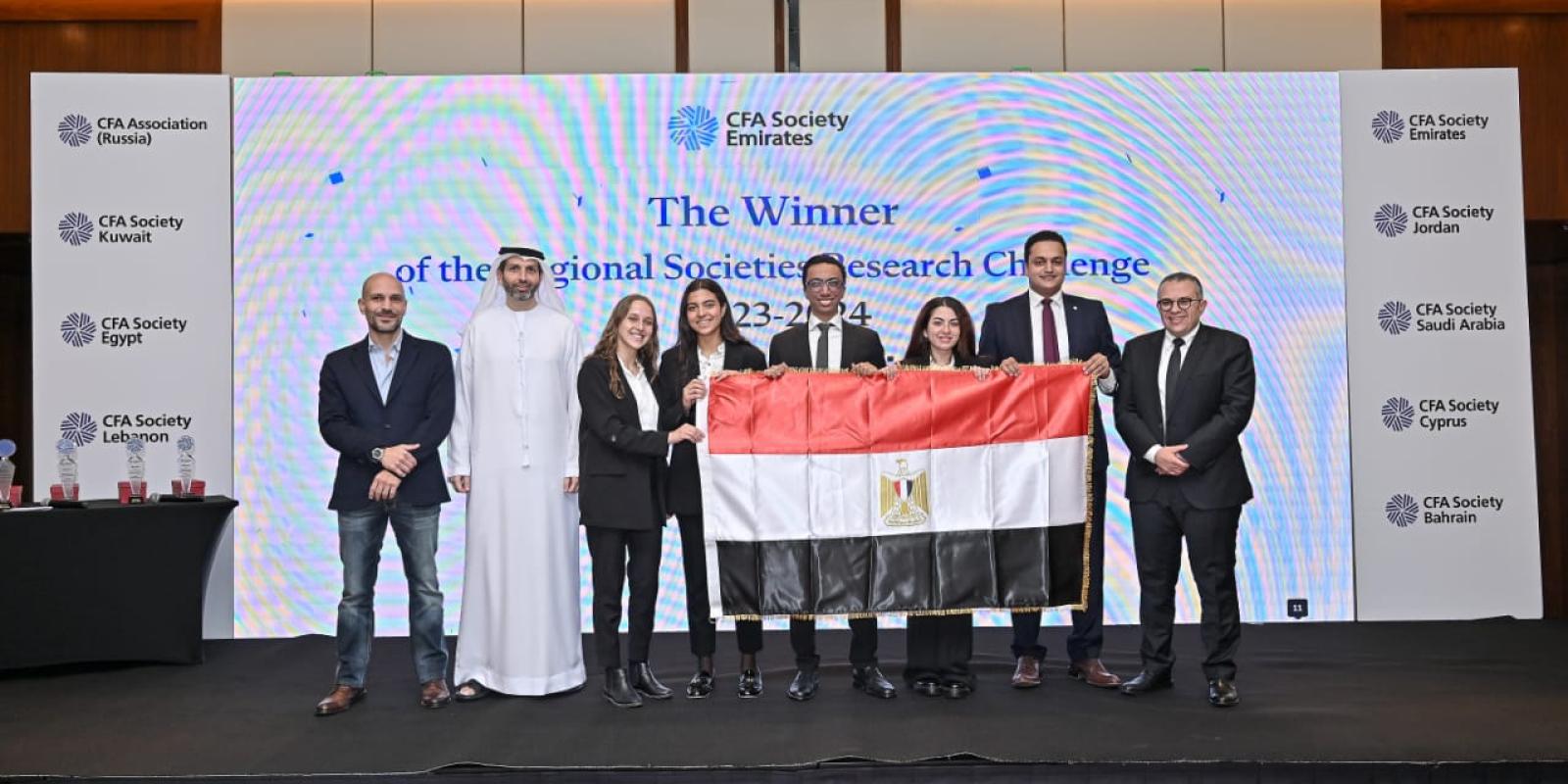 group of students from school of business group photo winning an award