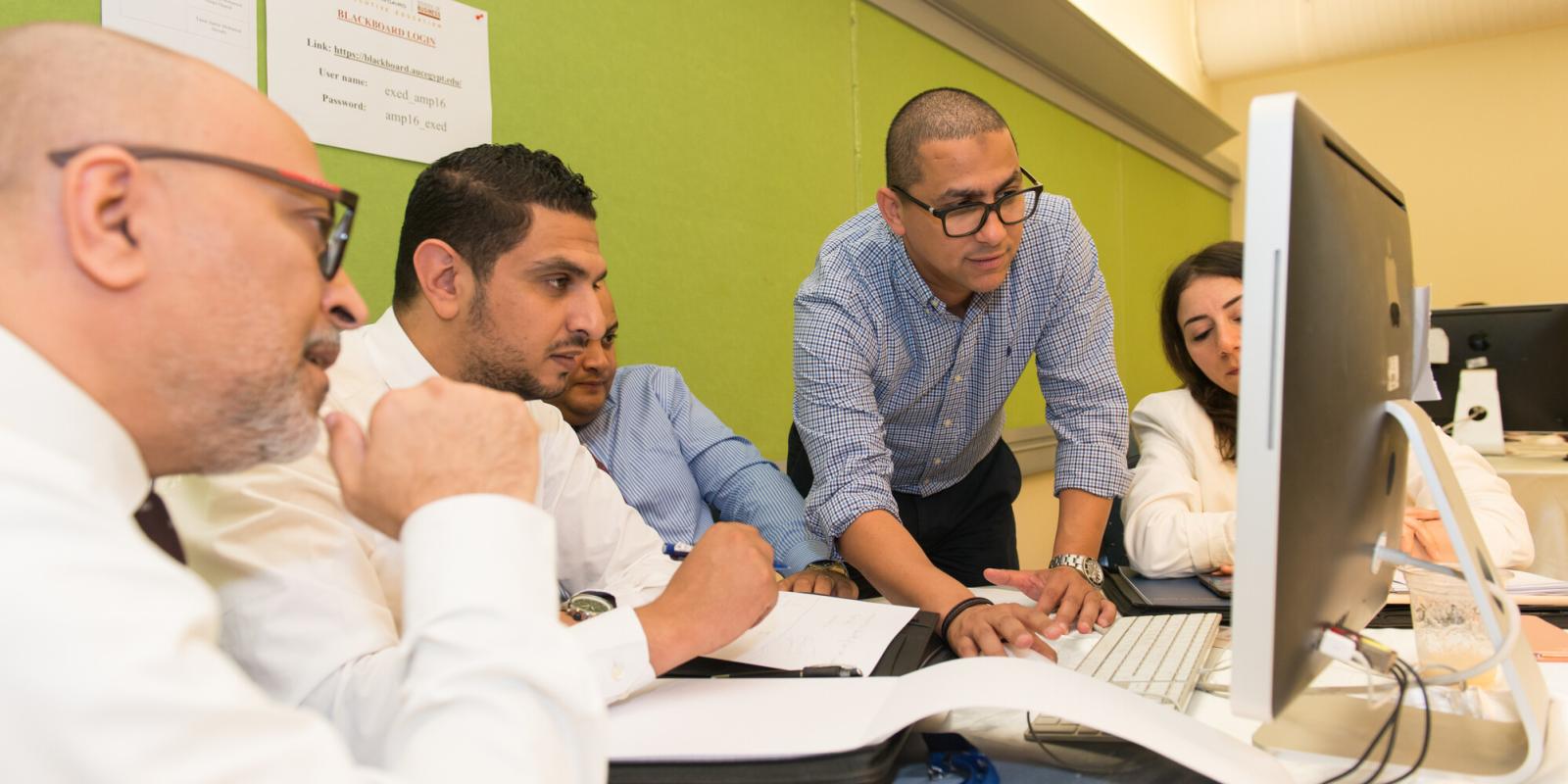 graduate students working on project in class