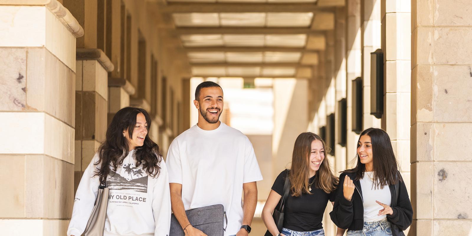 group of students talking and walking to class