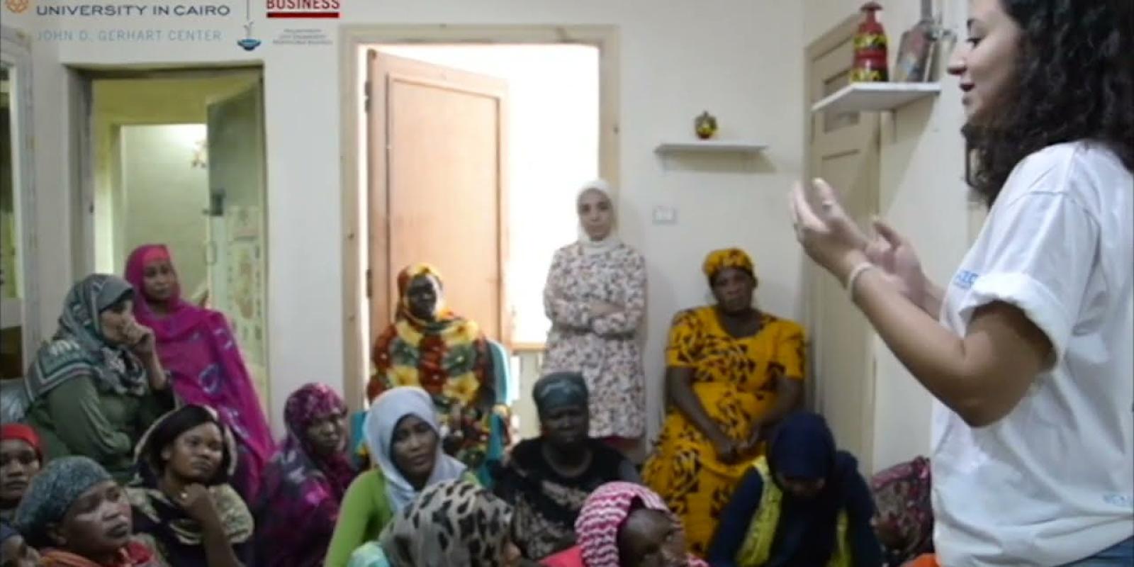 A female is talking to a group of women