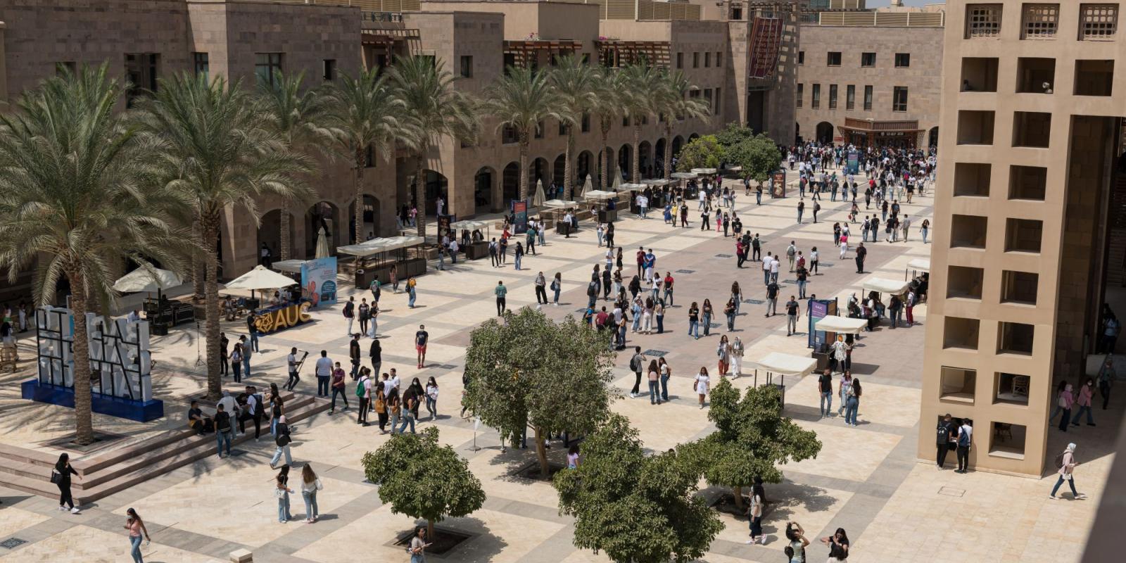 bartlett plaza during assembly hour with students walking on campus