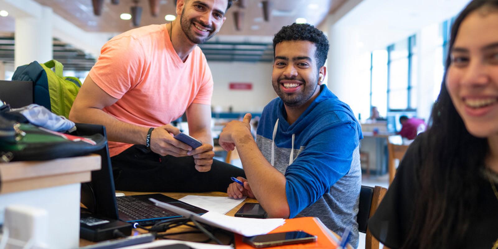 students working on project in the library