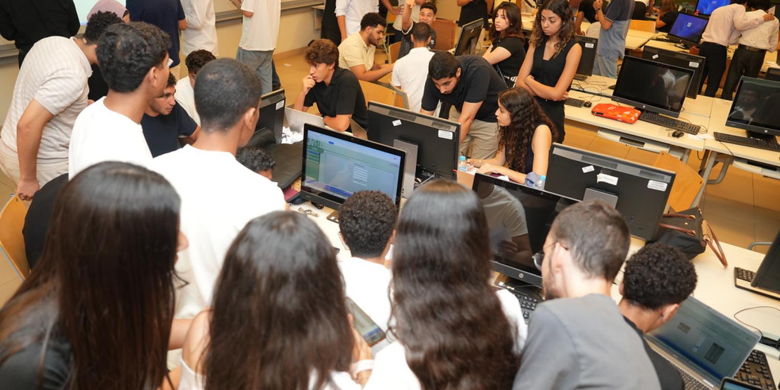 group of students working on finomics competition