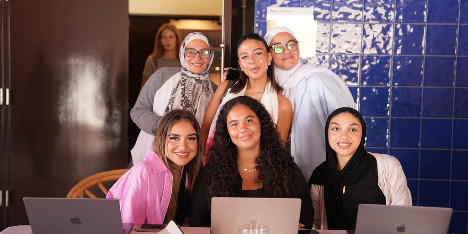 group of students working their laptops