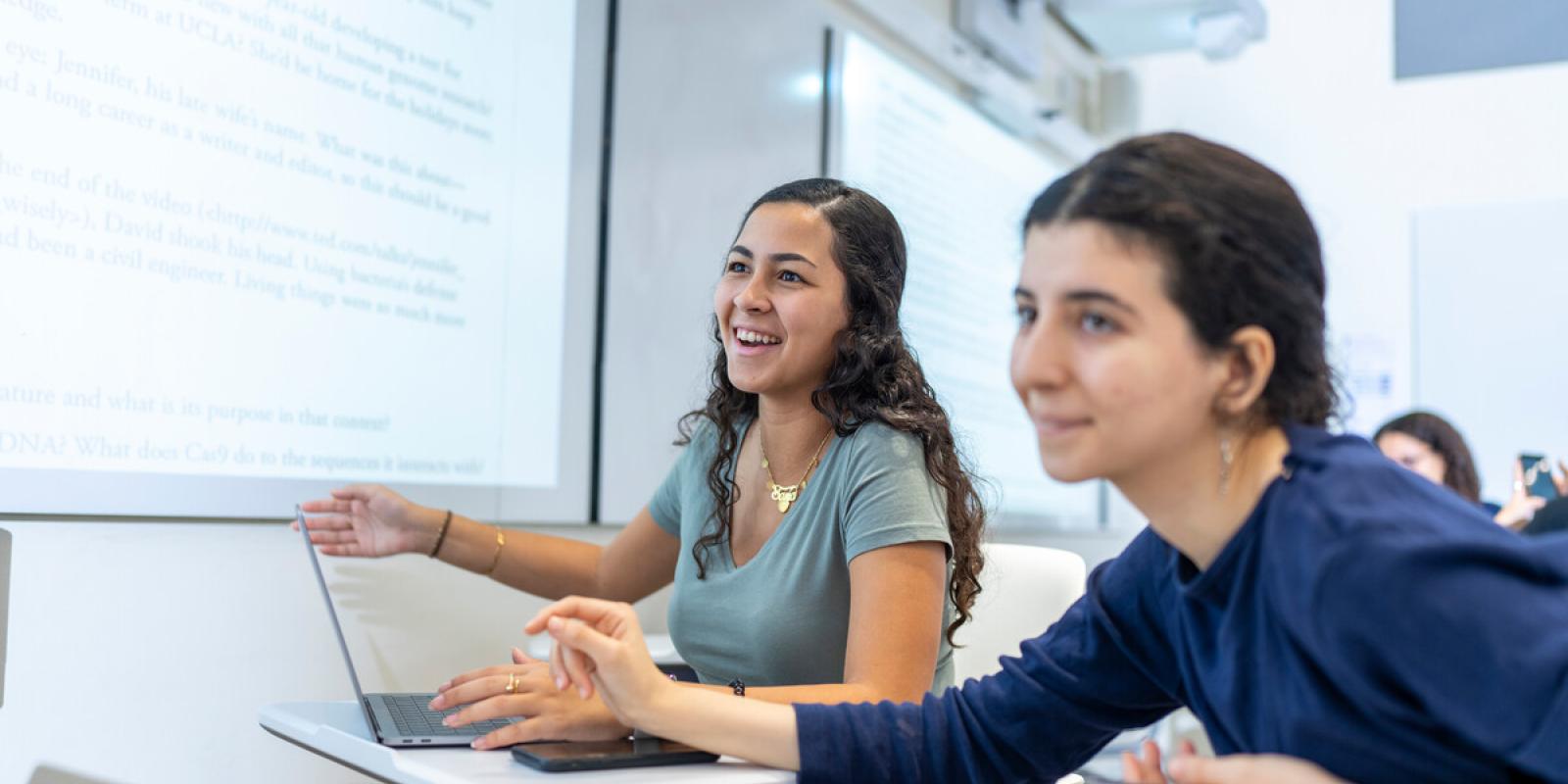 students in classroom using smart board during lecture