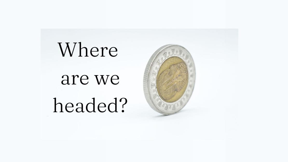 A single Egyptian pound coin rolls on its side with the text "Where are headed" in the bottom left