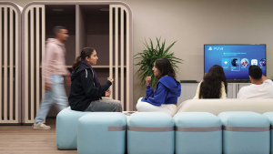 Students sitting on a couch in the innovation hub.