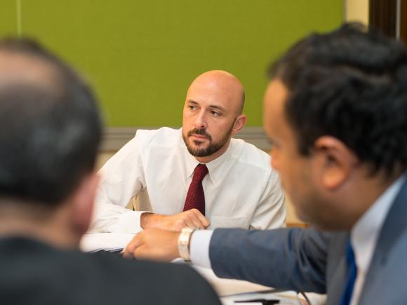 graduate students working in classroom on a project