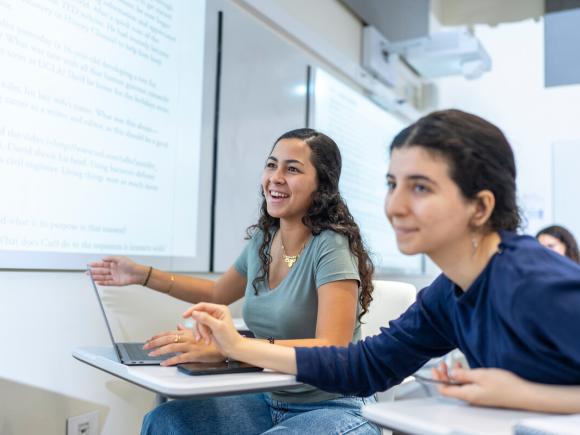 students in classroom using smart board during lecture
