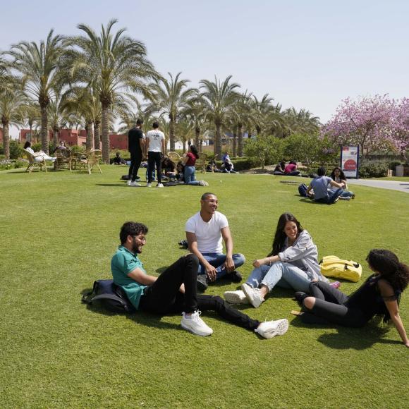 auc students in gardens talking and chatting