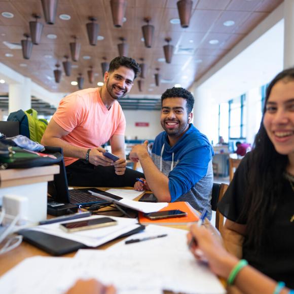 students working on project in the library