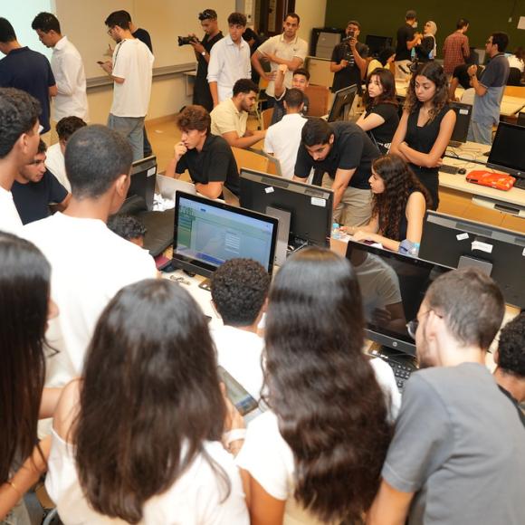 group of students working on finomics competition